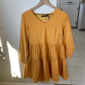 Yellow long sleeve ruffle dress